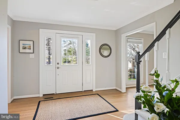 a kitchen with stainless steel appliances granite countertop a stove and a granite counter tops with white cabinets