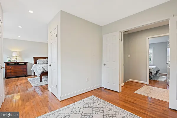 a bedroom with a bed and a mirror