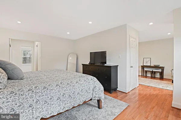 a bedroom with a bed and a couch