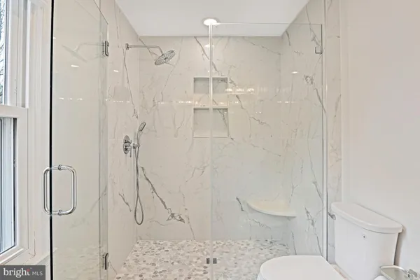 a view of a house with backyard porch and sitting area