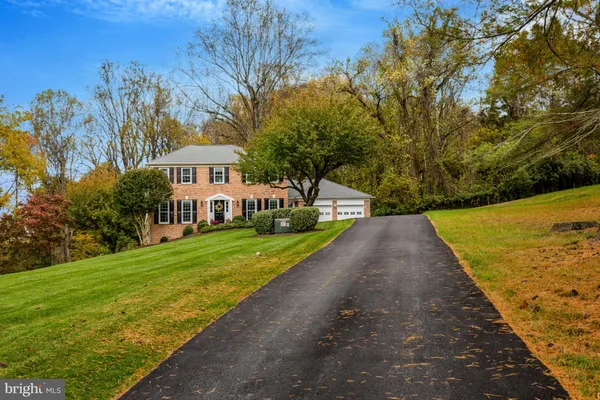 a view of a garden with a building in the background