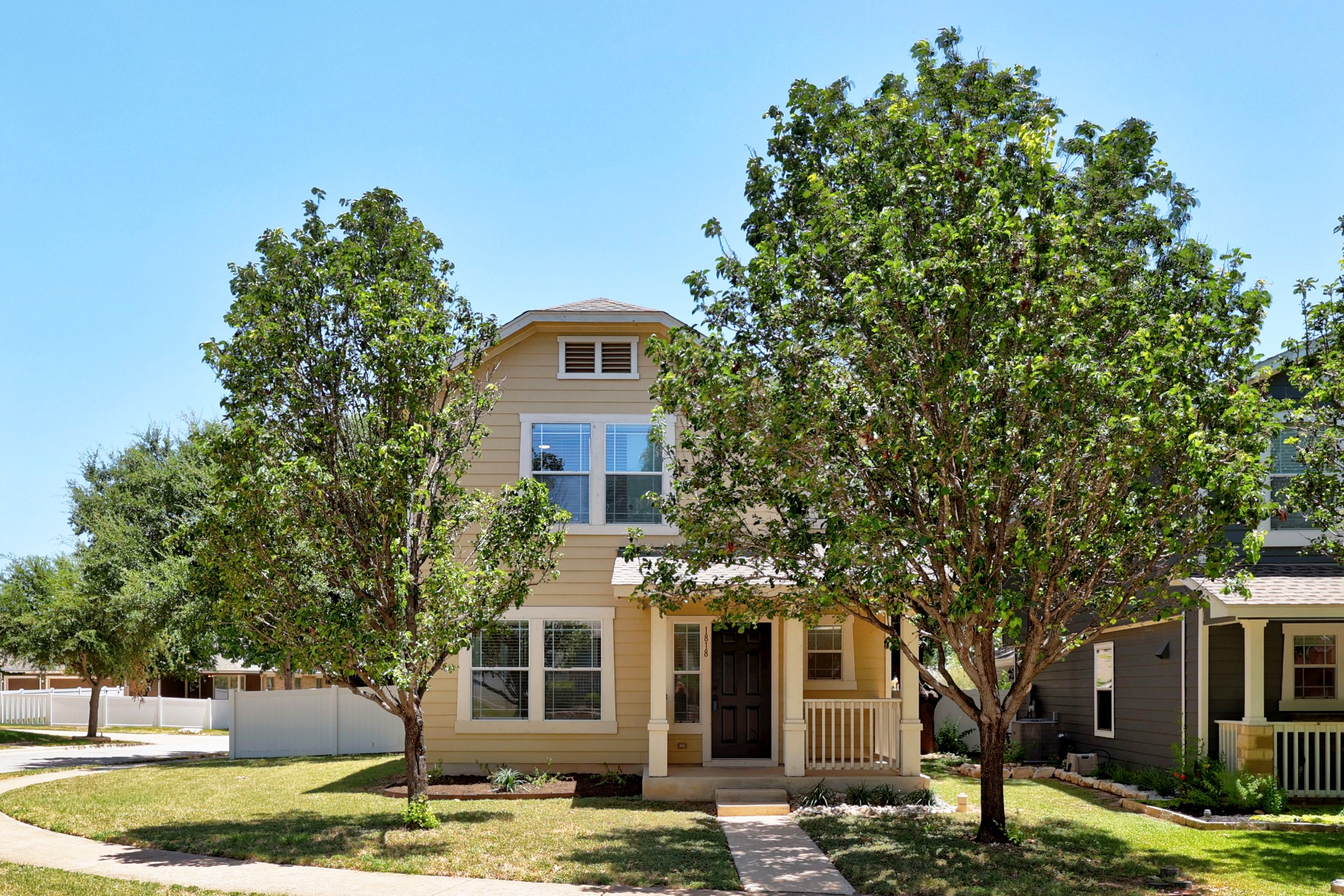 1818 Lost Maples Loop Cedar Park, TX 78613 - Photo 2 of 38 A welcoming front facade with a covered porch and mature trees frames this charming residence.