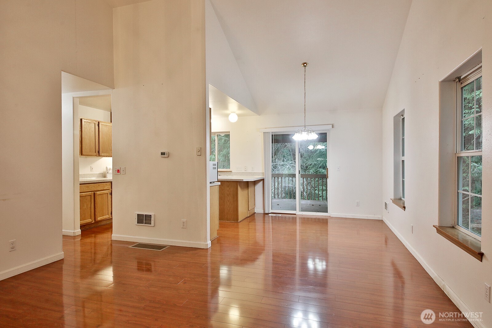 4369 Shadowood Drive Clinton, WA 98236 - Photo 14 of 37 a view of an empty room with wooden floor and a window