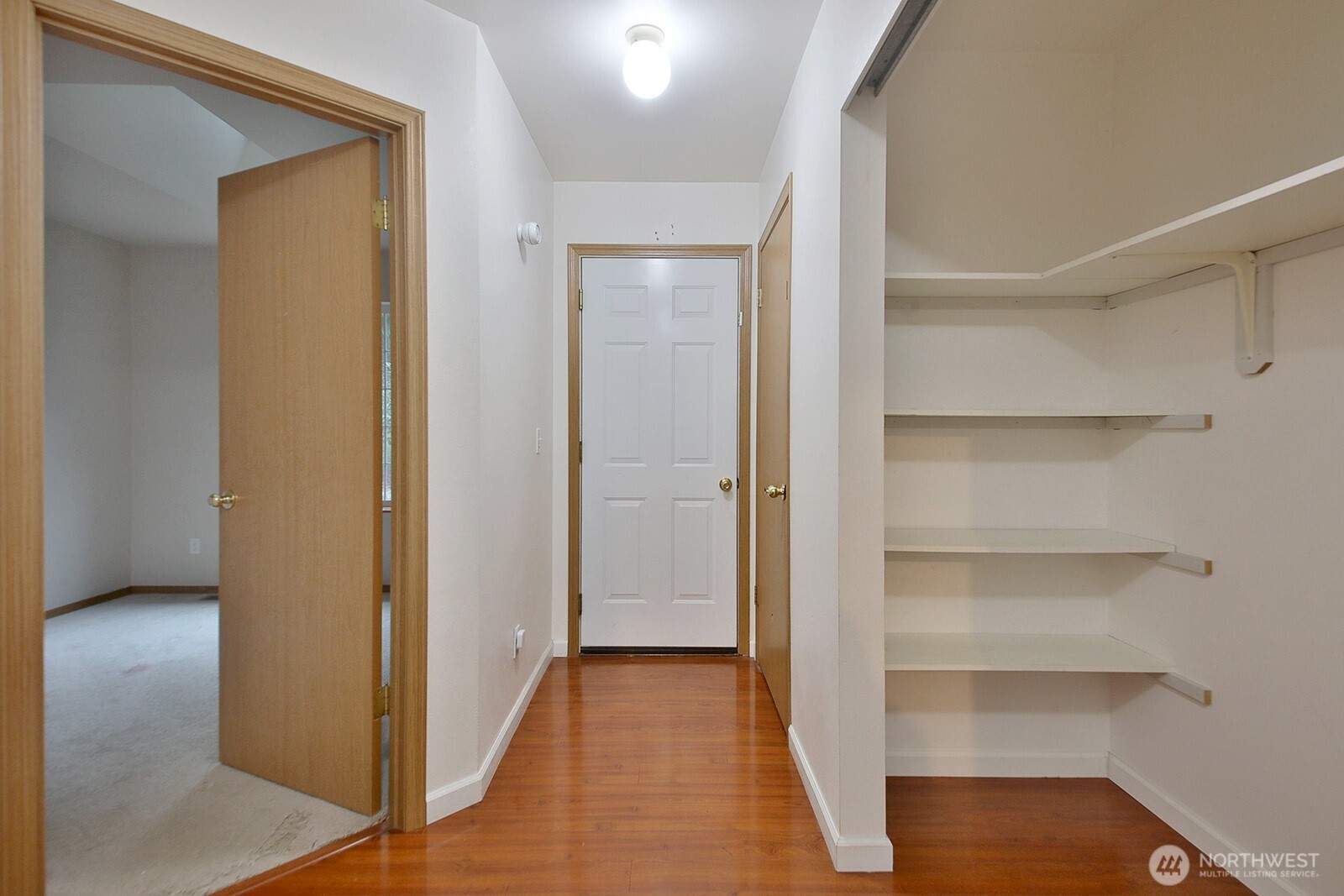 4369 Shadowood Drive Clinton, WA 98236 - Photo 29 of 37 a view of a hallway with wooden floor