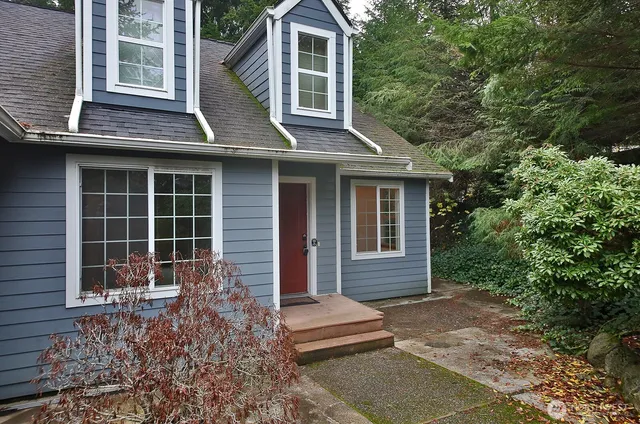 a front view of a house with garden
