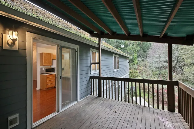 a view of balcony with wooden floor