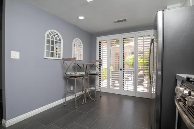 a view of a livingroom with furniture and hardwood floor