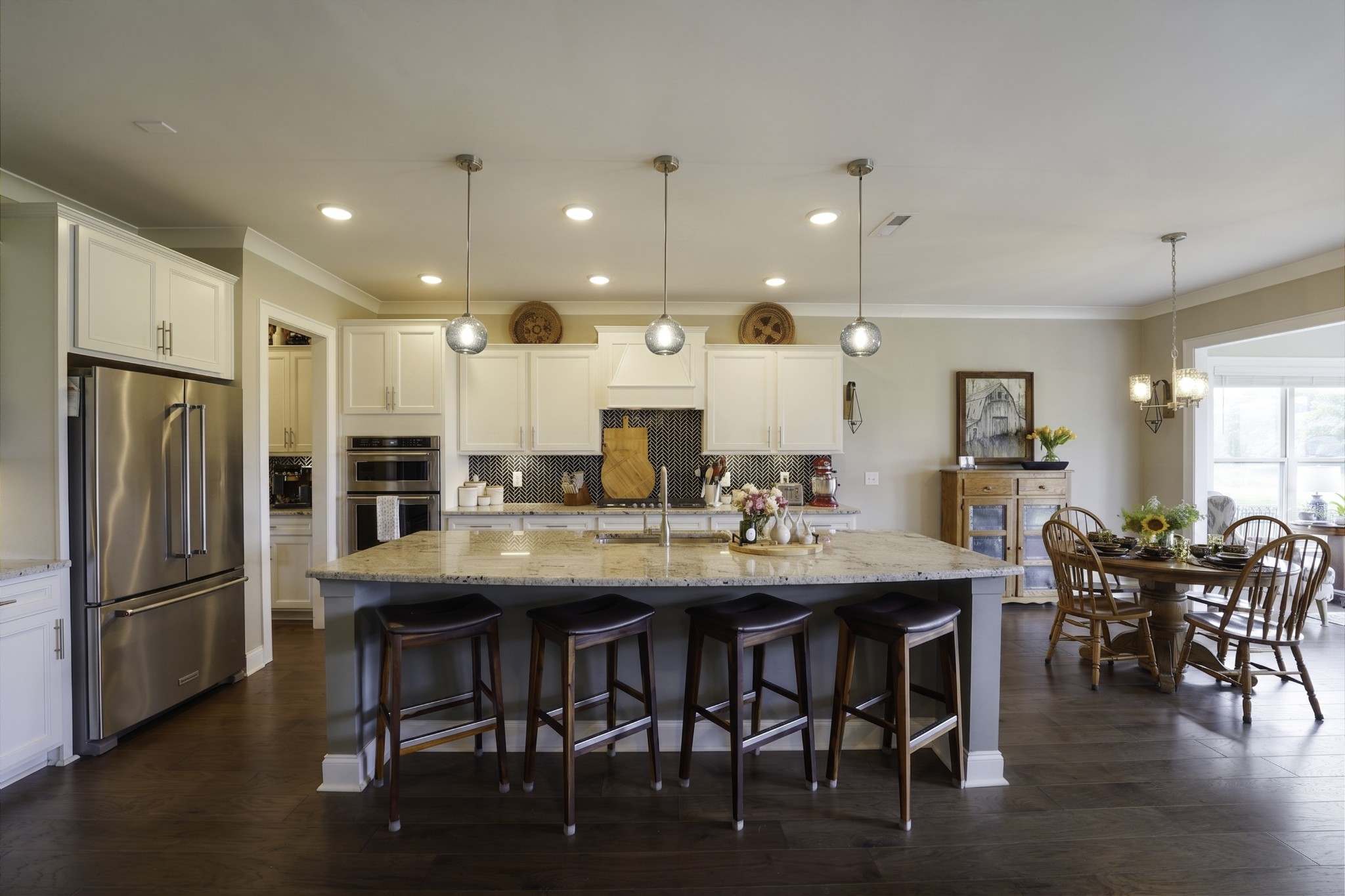 806 Chalkstone Ln Mount Mount Juliet, TN 37122 - Photo 35 of 65 a kitchen with stainless steel appliances kitchen island granite countertop a dining table chairs and a refrigerator