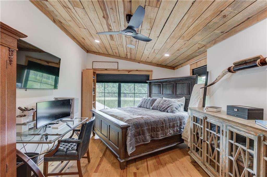 3698 Highway 83 Good Hope, GA 30641 - Photo 39 of 81 a bedroom with a bed a flat screen tv and balcony view