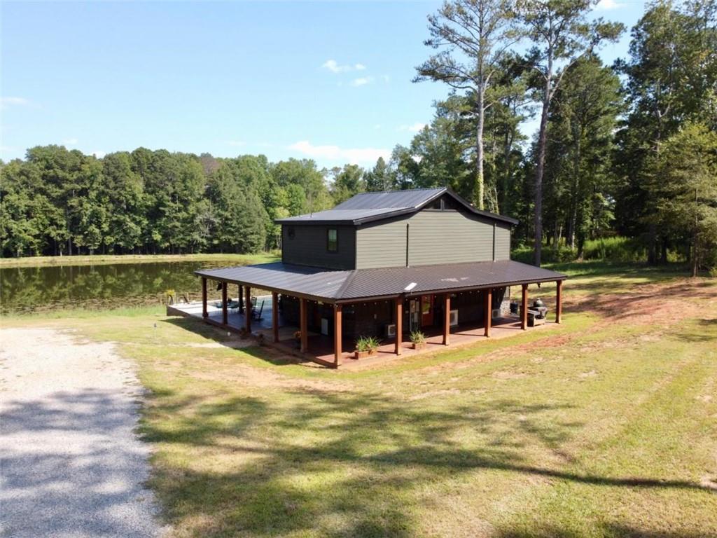 3698 Highway 83 Good Hope, GA 30641 - Photo 4 of 81 a view of a house with pool and chairs