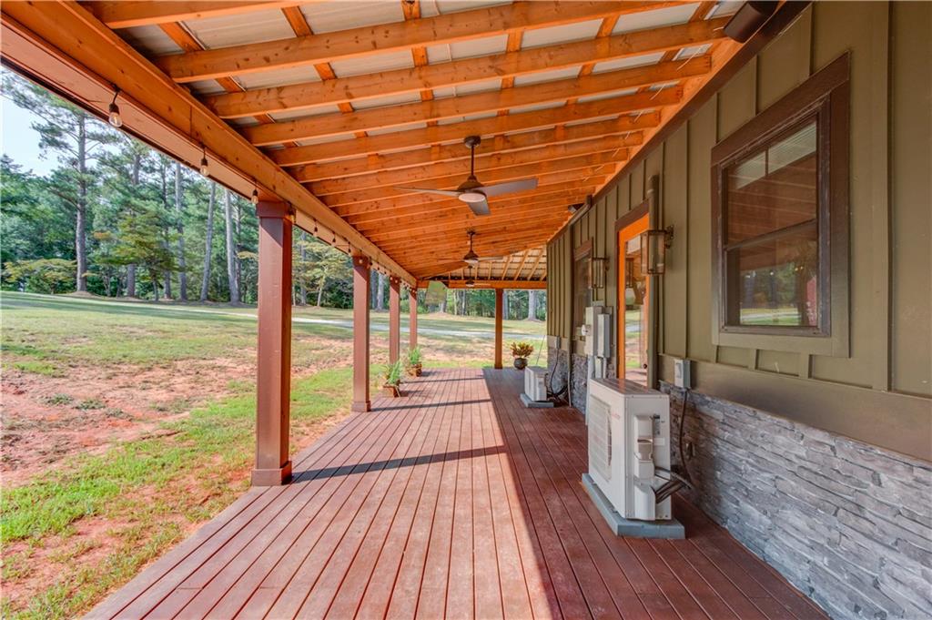 3698 Highway 83 Good Hope, GA 30641 - Photo 54 of 81 a porch with wooden floors in front of a house
