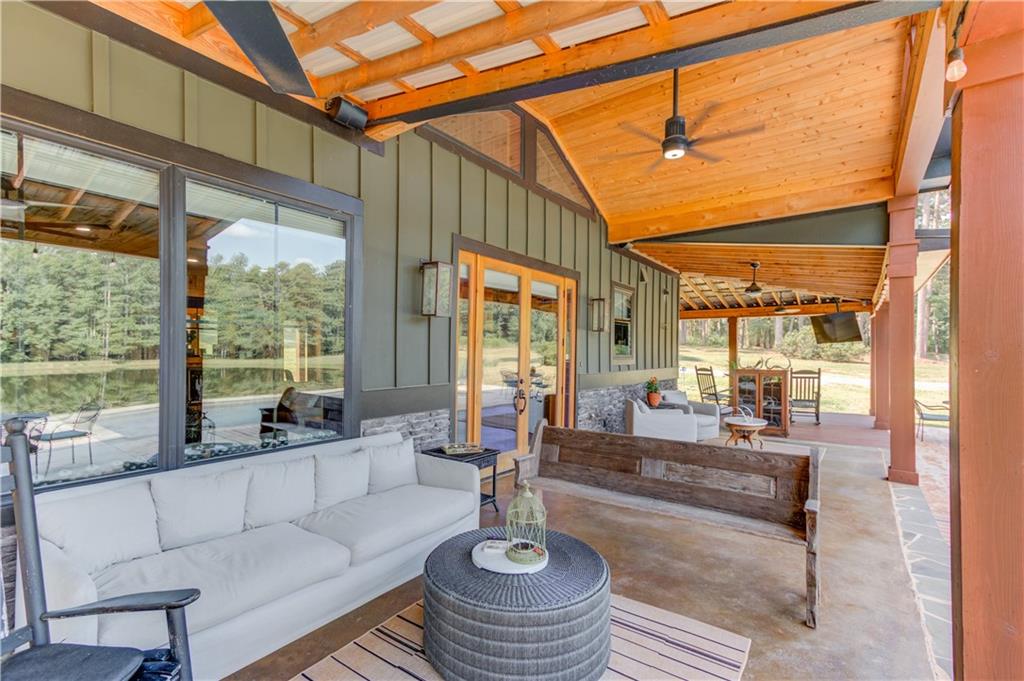 3698 Highway 83 Good Hope, GA 30641 - Photo 56 of 81 a living room with furniture and a floor to ceiling window