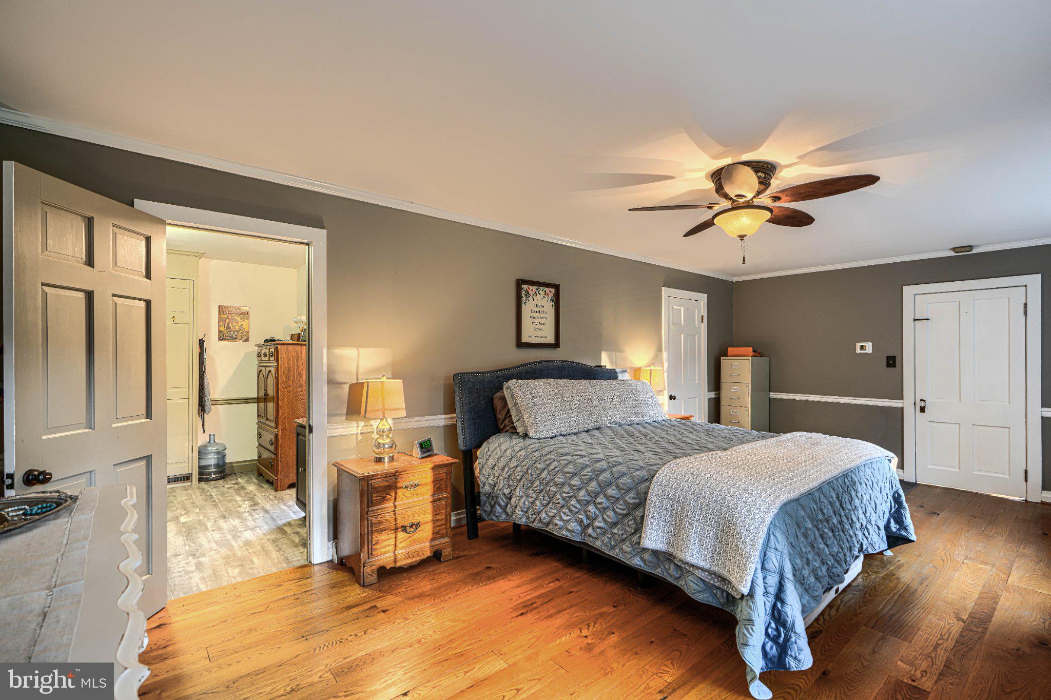 5947 Appletown Road Boonsboro, MD 21713 - Photo 31 of 114 Serene bedroom with warm wood tones.