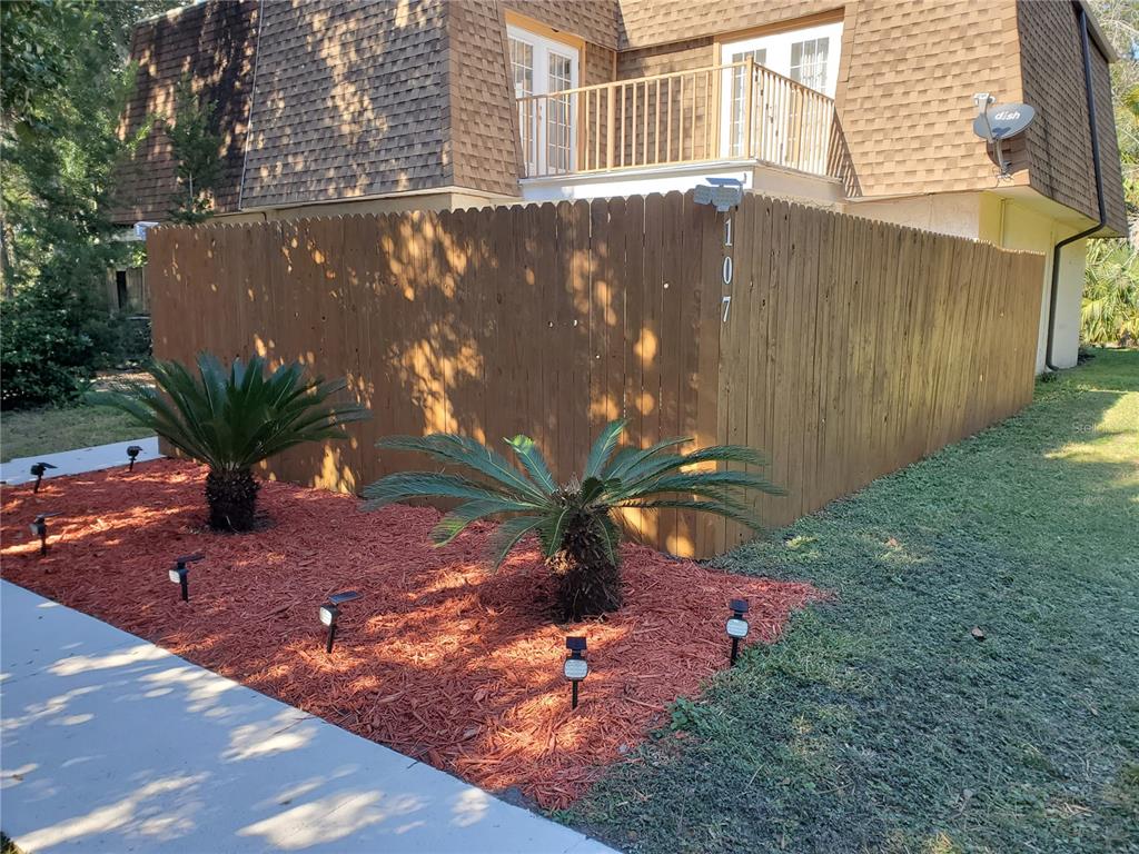 107 Springwood Square Port Orange, FL 32129 - Photo 1 of 36 a backyard of a house