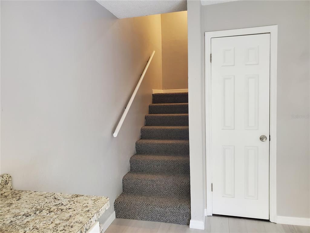 107 Springwood Square Port Orange, FL 32129 - Photo 19 of 36 a view of entryway with wooden floor