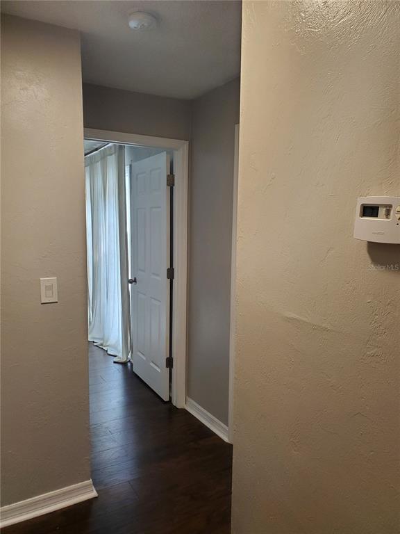 107 Springwood Square Port Orange, FL 32129 - Photo 21 of 36 a view of a hallway with wooden floor