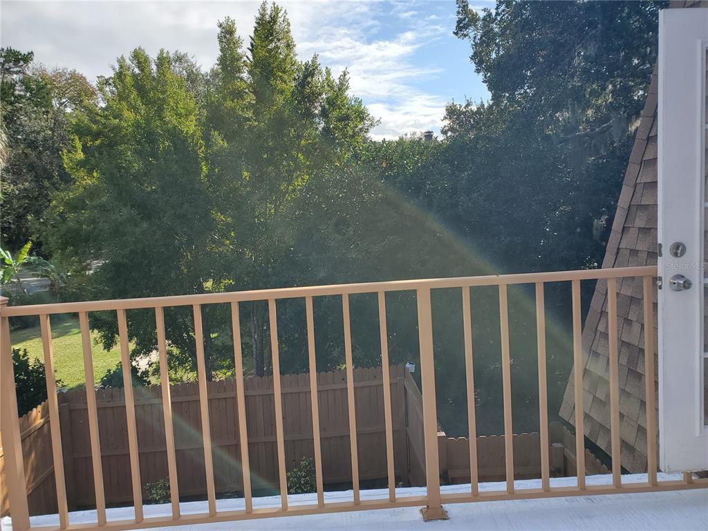 107 Springwood Square Port Orange, FL 32129 - Photo 26 of 36 a view of a balcony