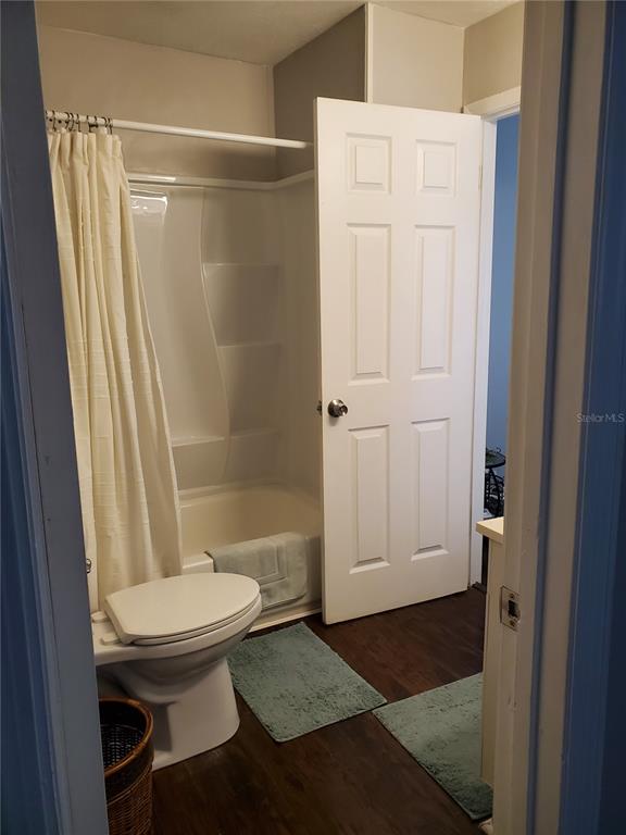 107 Springwood Square Port Orange, FL 32129 - Photo 29 of 36 a bathroom with a toilet and a shower