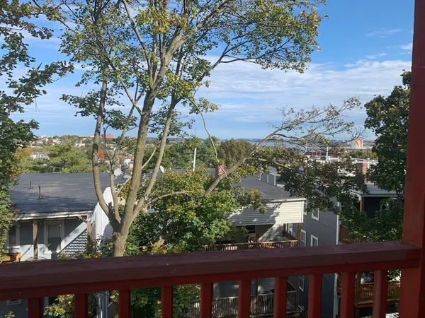 a view of a yard from a balcony