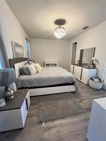 a bedroom with a bed and couch