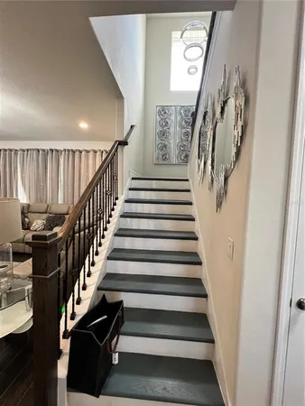 a view of entryway with stairs and wooden floor