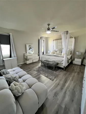 a bathroom with a sink a toilet and a shower