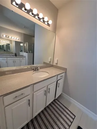 a bedroom with a bed window and couch