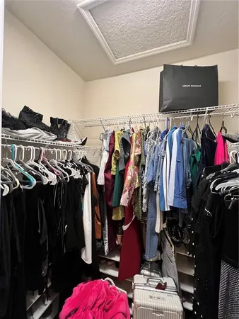 a bathroom with a sink a toilet and a shower