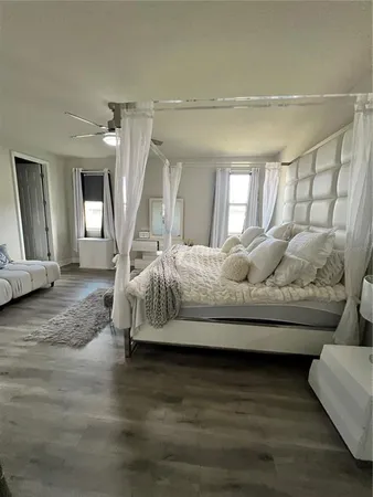 a spacious bathroom with a double vanity sink a mirror and a