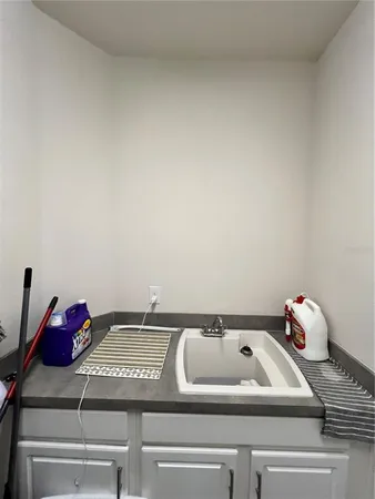 a bedroom with a bed window and a ceiling fan