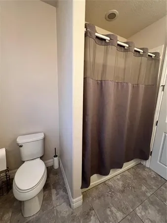 a view of a hallway with windows