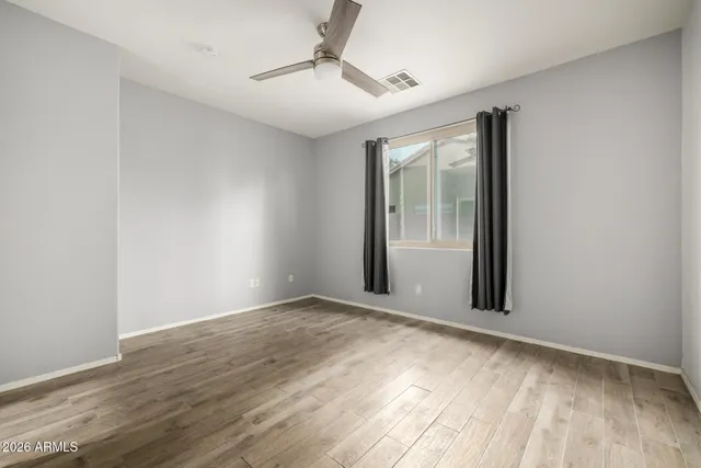 a view of an empty room with glass door