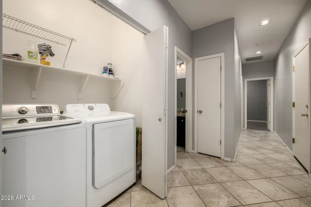 a utility room with dryer and washer