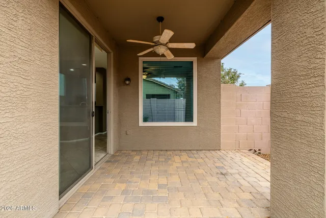 a view of a hallway with wooden walls and windows