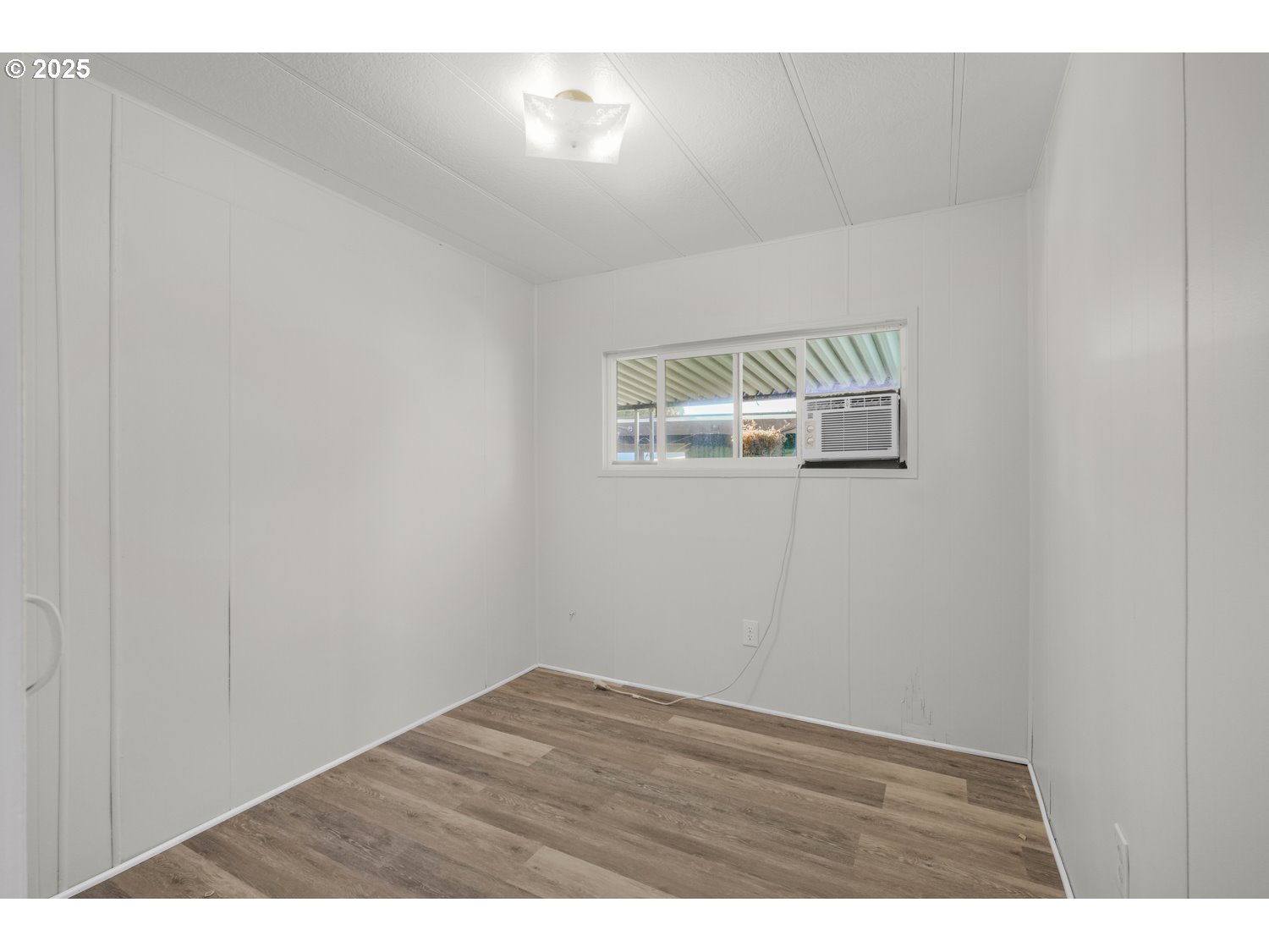 5355 River Road North, Unit 85 Keizer, OR 97303 - Photo 13 of 25 a view of empty room with wooden floor