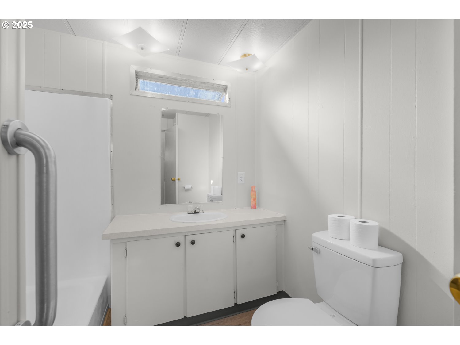 5355 River Road North, Unit 85 Keizer, OR 97303 - Photo 17 of 25 a bathroom with a sink a toilet and mirror