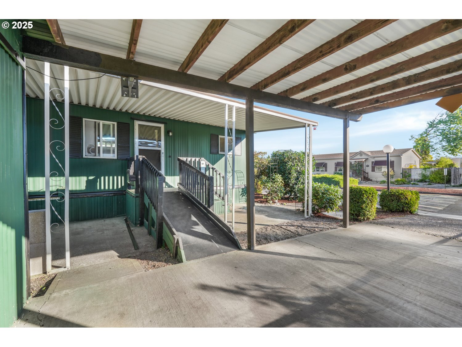 5355 River Road North, Unit 85 Keizer, OR 97303 - Photo 22 of 25 a view of a porch with furniture
