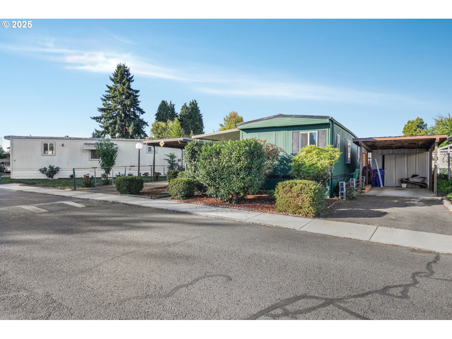 5355 River Road North, Unit 85 Keizer, OR 97303 - Photo 25 of 25 a front view of a house with a yard and potted plants