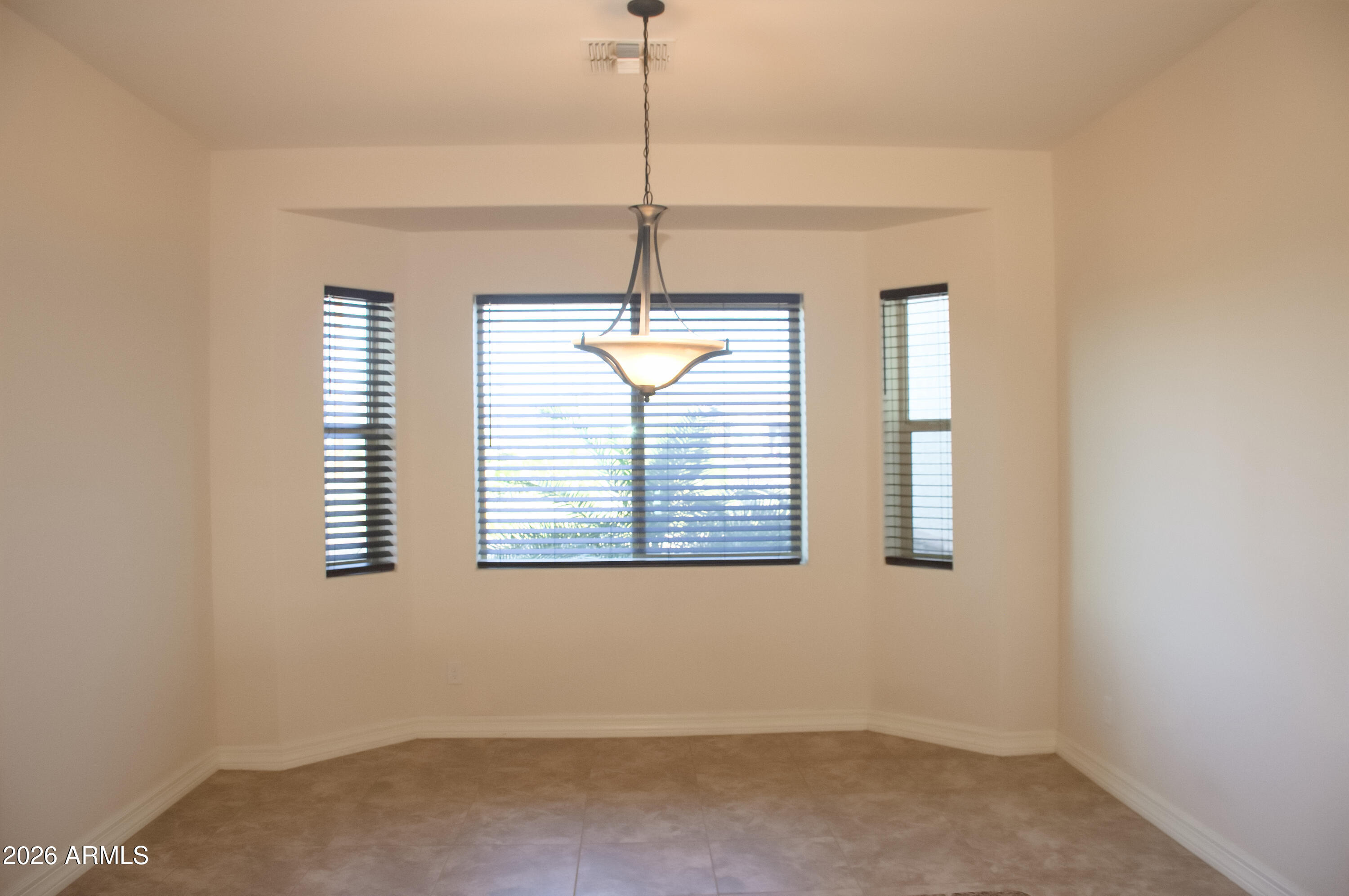 1623 East Hidalgo Street Apache Junction, AZ 85119 - Photo 17 of 65 a room with window and a chandelier