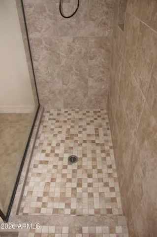 a view of a livingroom with a dishwasher and a window