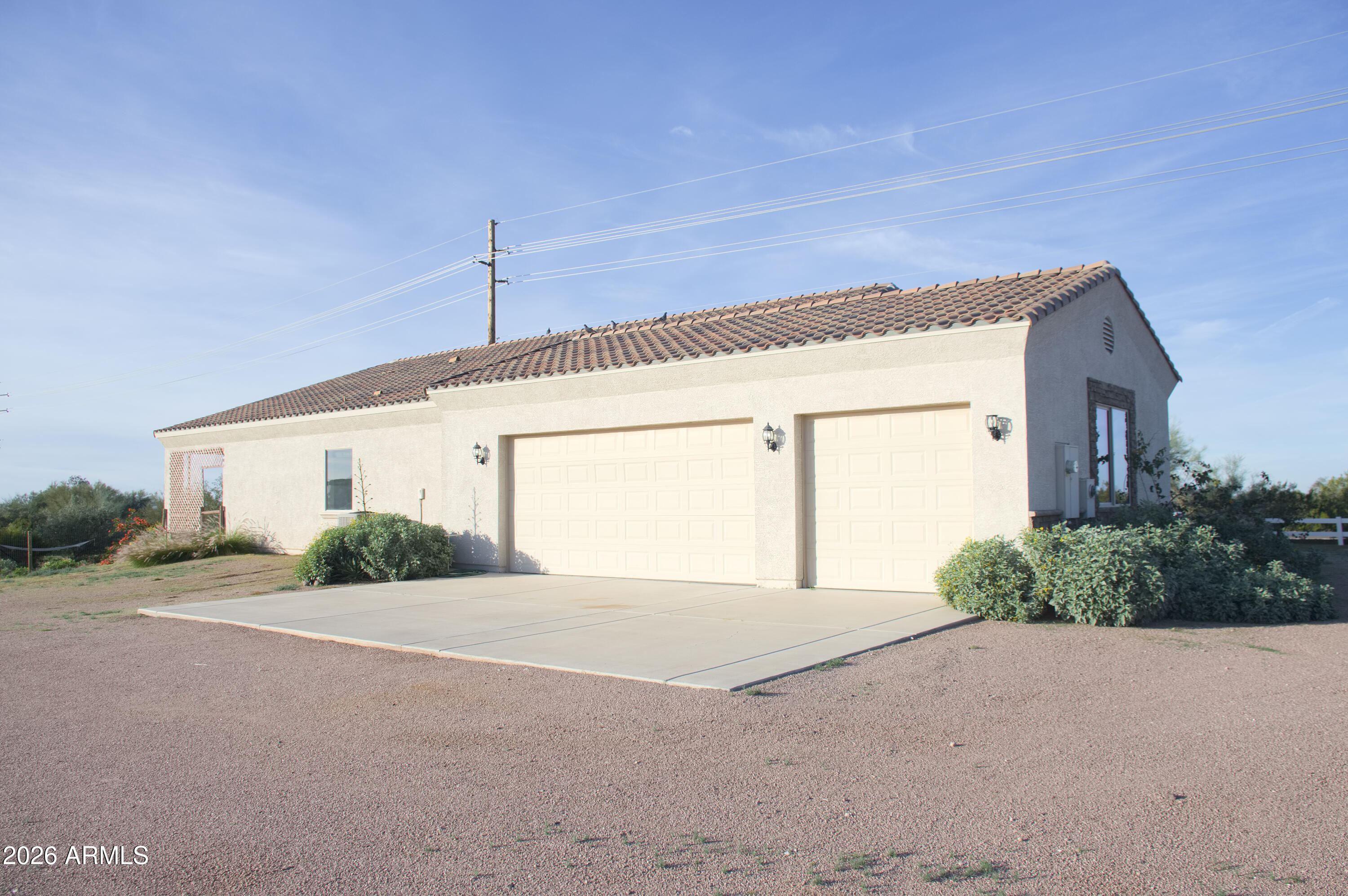 1623 East Hidalgo Street Apache Junction, AZ 85119 - Photo 33 of 65 a front view of a house with a yard and garage