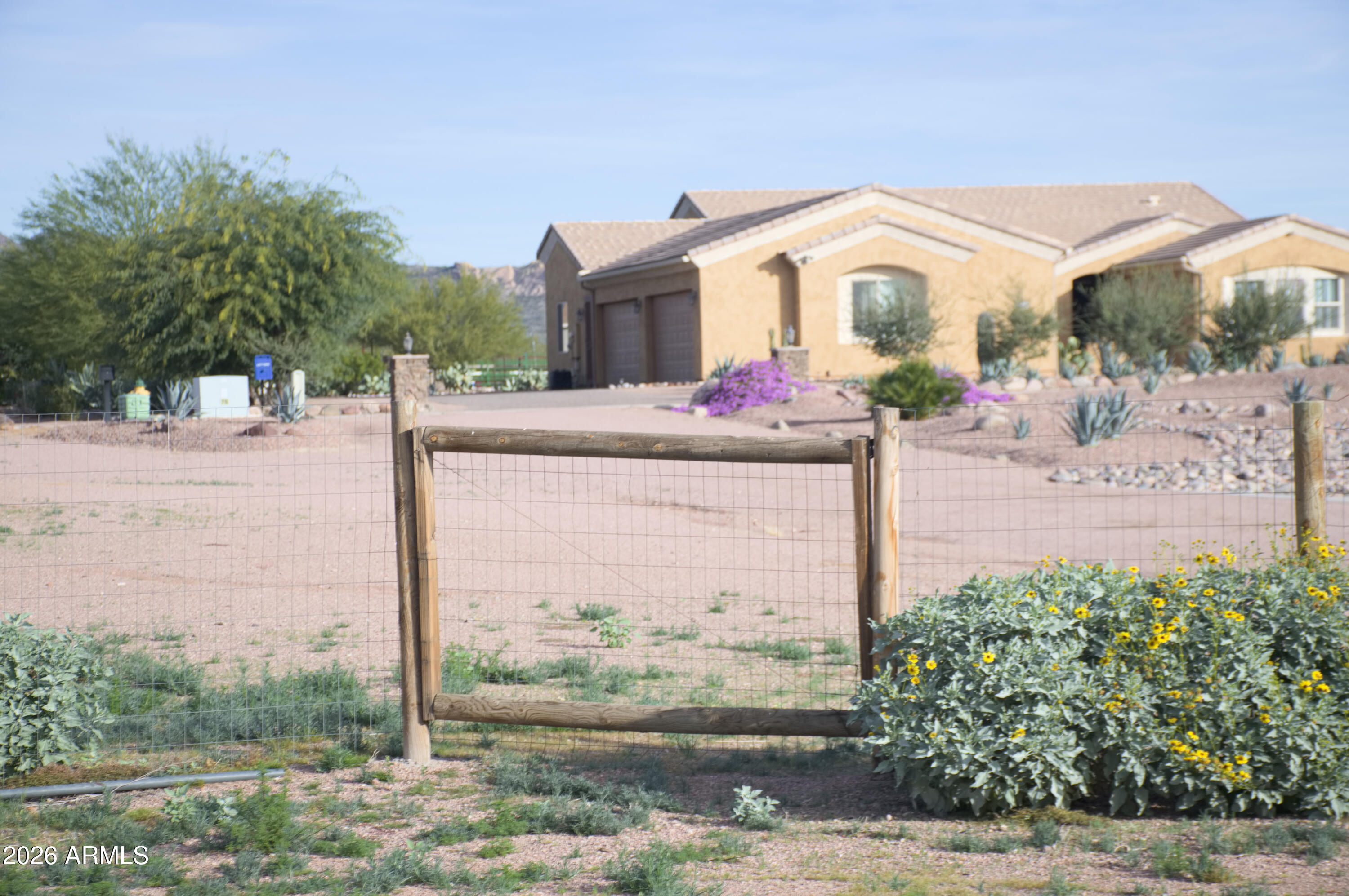1623 East Hidalgo Street Apache Junction, AZ 85119 - Photo 42 of 65 a front view of a house with garden