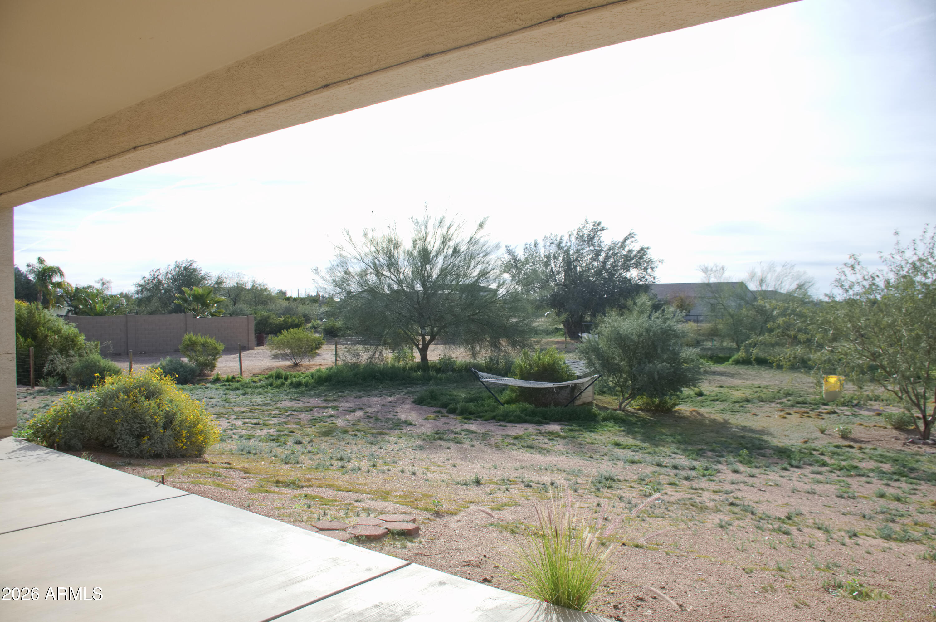 1623 East Hidalgo Street Apache Junction, AZ 85119 - Photo 43 of 65 a view of a dry yard with wooden fence