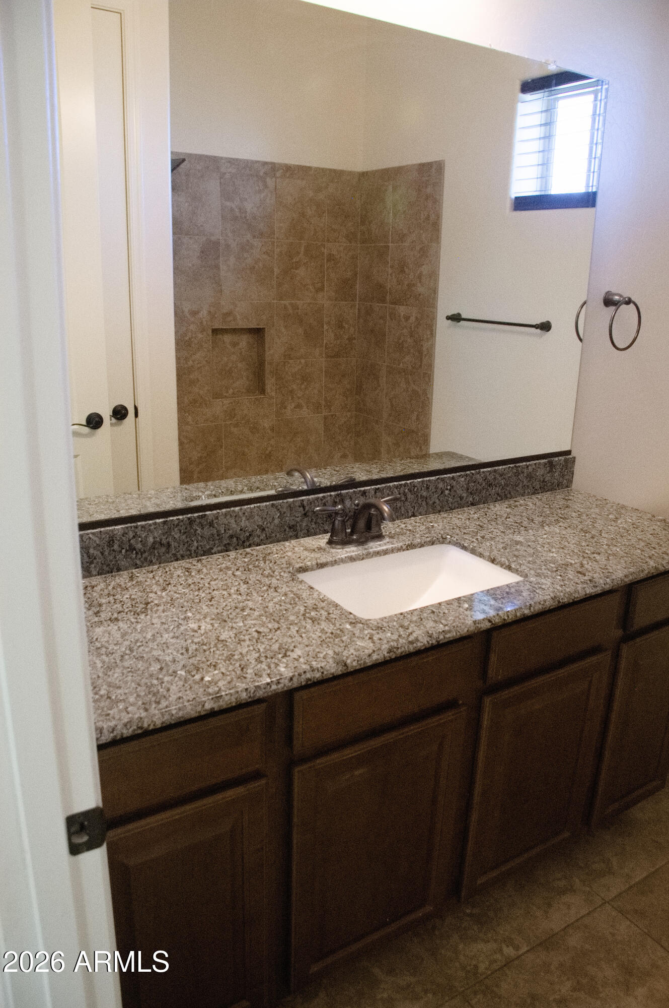 1623 East Hidalgo Street Apache Junction, AZ 85119 - Photo 50 of 65 a bathroom with a granite countertop sink and a mirror