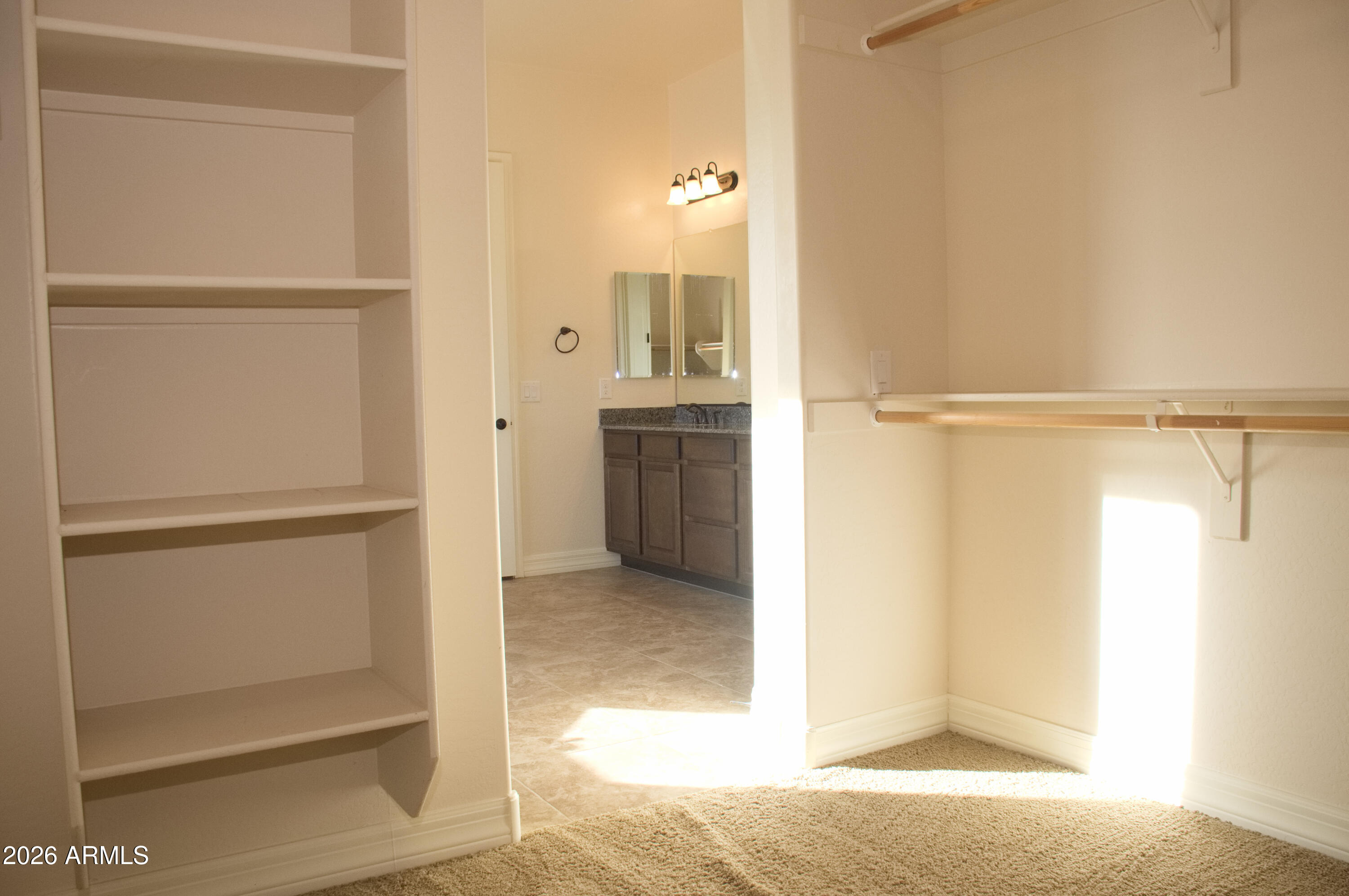1623 East Hidalgo Street Apache Junction, AZ 85119 - Photo 58 of 65 a view of walk in closet with empty racks
