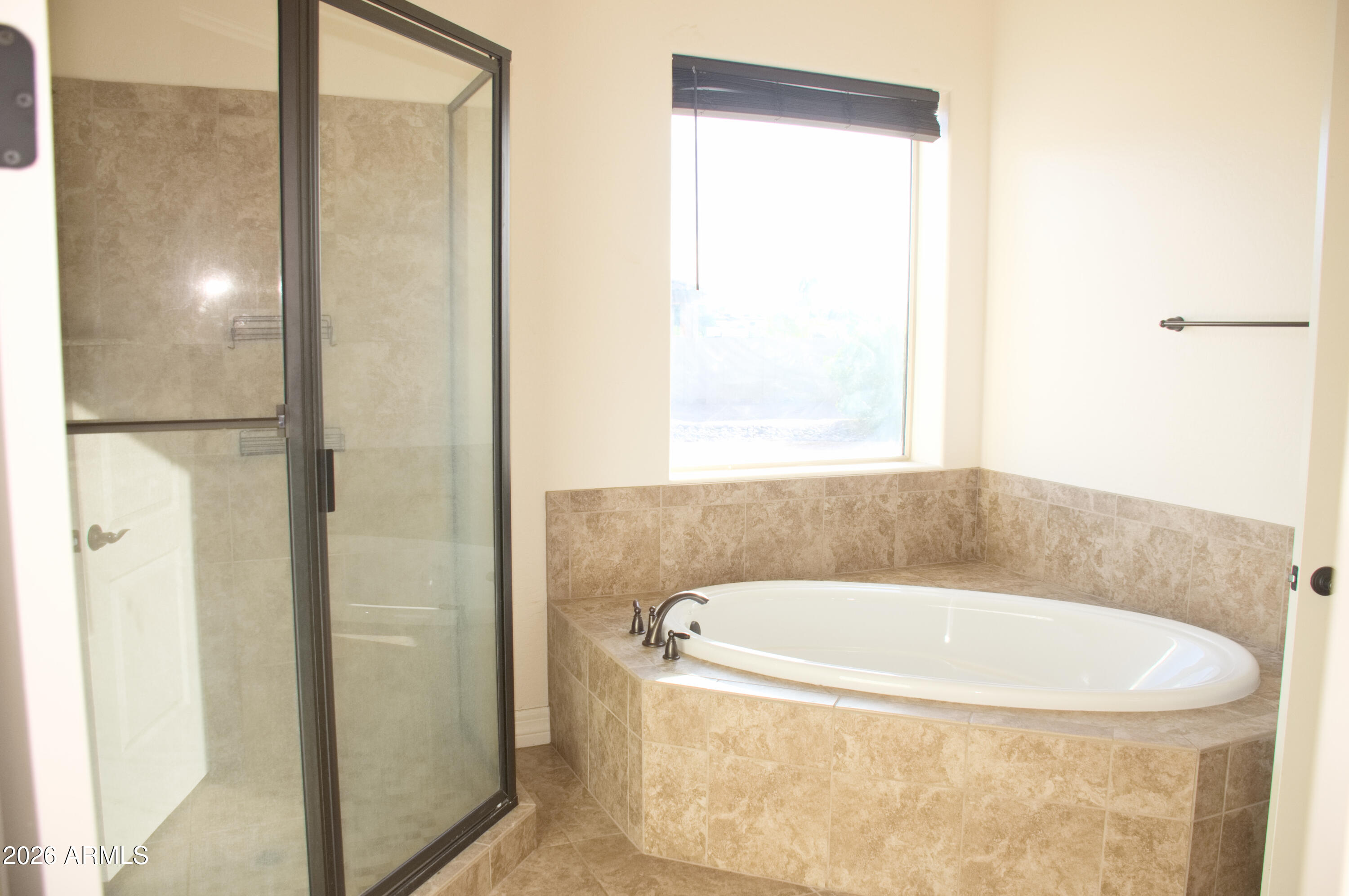 1623 East Hidalgo Street Apache Junction, AZ 85119 - Photo 60 of 65 a white bath tub sitting next to a window
