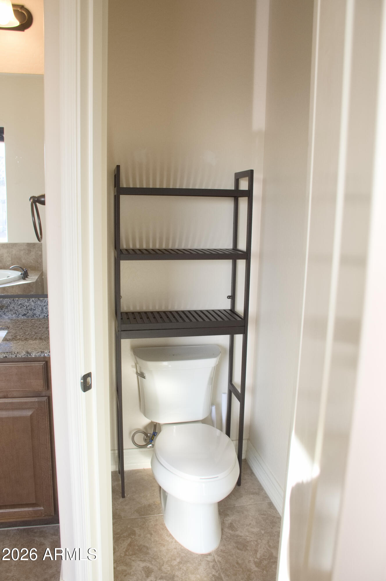 1623 East Hidalgo Street Apache Junction, AZ 85119 - Photo 62 of 65 a bathroom with a toilet