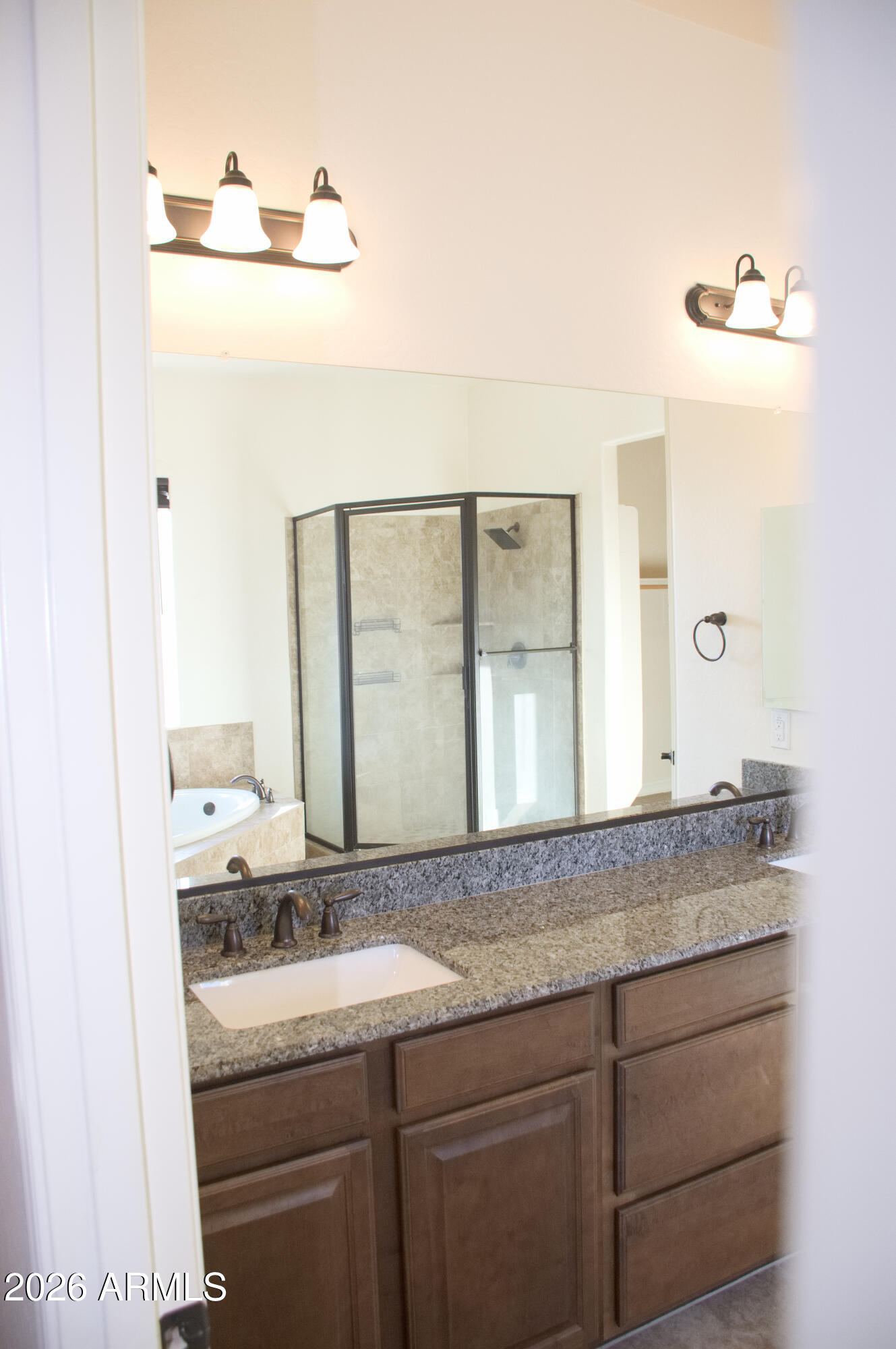 1623 East Hidalgo Street Apache Junction, AZ 85119 - Photo 63 of 65 a en suite bathroom with a granite countertop sink and a mirror