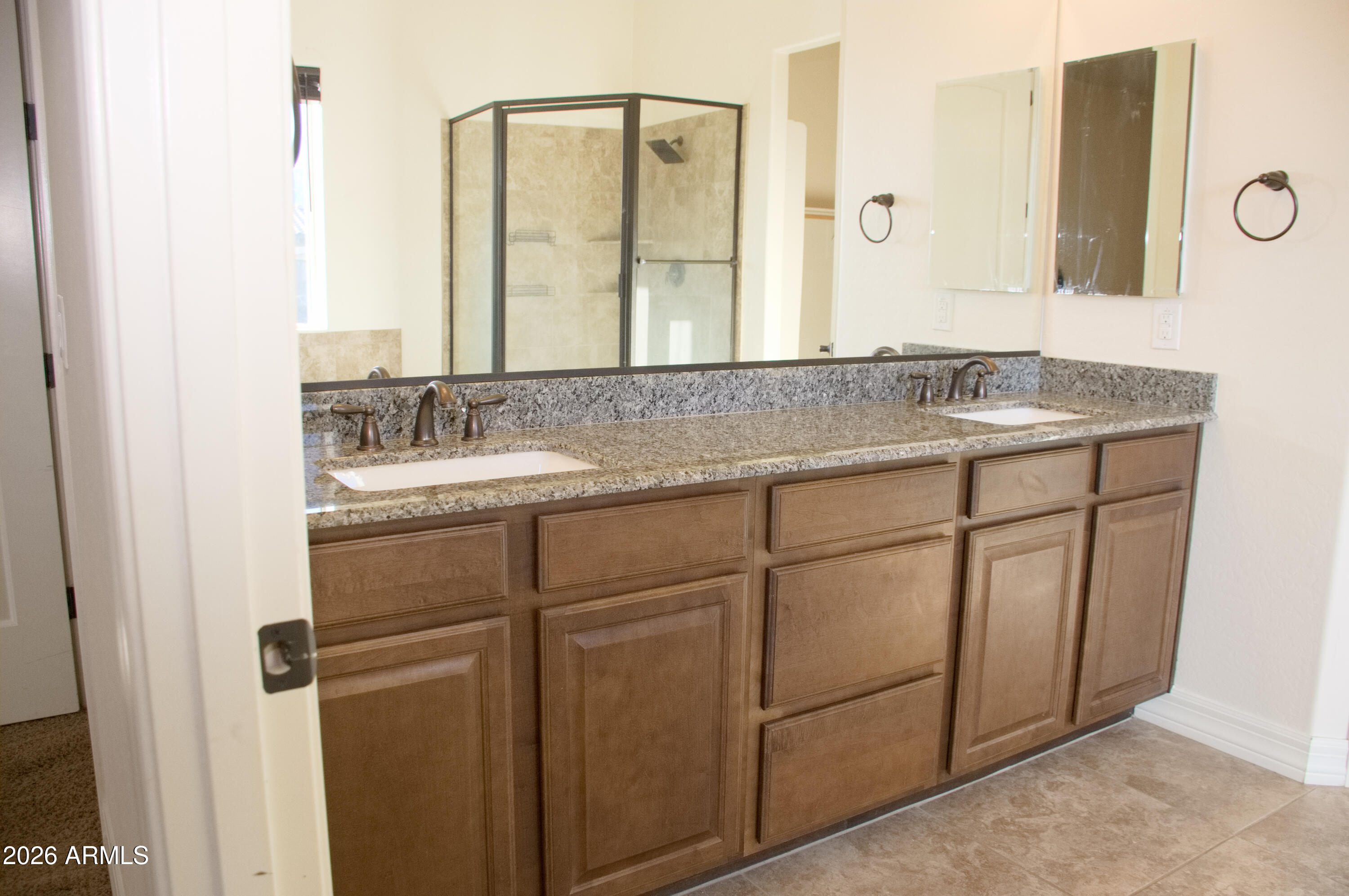 1623 East Hidalgo Street Apache Junction, AZ 85119 - Photo 64 of 65 a bathroom with a granite countertop sink and a mirror