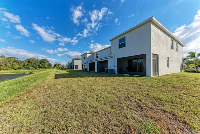 a view of a lake with houses in the background